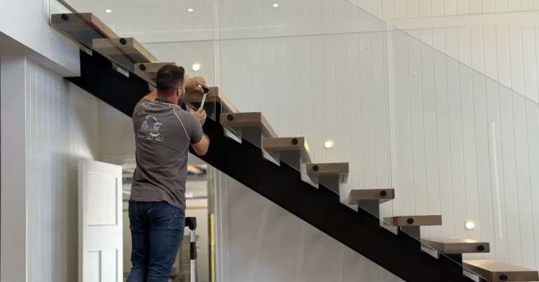 Custom staircase balustrade installation by AMG Fabrication