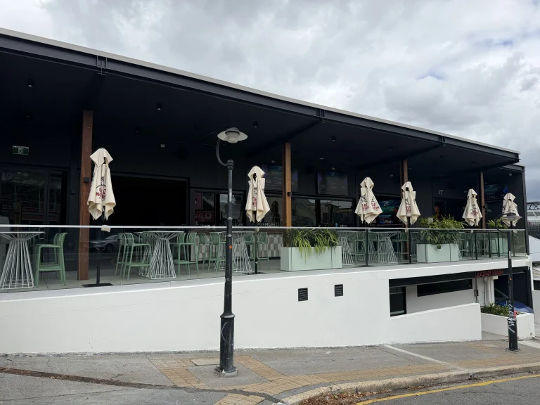 Custom semi-frameless glass balustrade installed on an outdoor verandah in Queensland